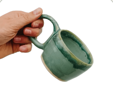 A green glazed mug